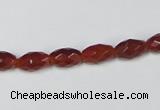 CAA124 15.5 inches 6*10mm faceted rice red agate gemstone beads