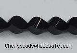 CAB336 15.5 inches 10*14mm faceted & twisted rice black agate beads