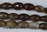 CAG3129 15.5 inches 10*14mm faceted rice brown line agate beads