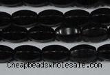 CAG6029 15.5 inches 6*10mm faceted rice matte black agate beads