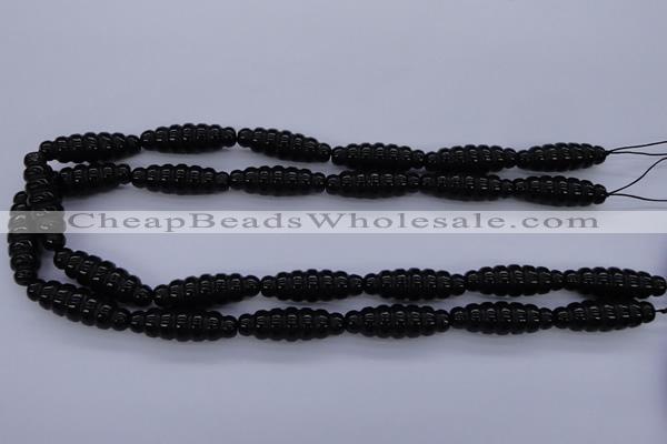 CFG760 15.5 inches 10*30mm carved rice black agate beads