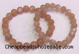 CGB4587 7.5 inches 8mm - 9mm round sunstone beaded bracelets