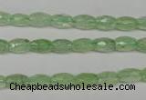 CRU165 15.5 inches 5*8mm faceted rice green rutilated quartz beads