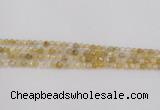 CRU666 15.5 inches 4mm faceted round golden rutilated quartz beads