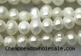 FWP05 14.5 inches 2mm - 2.5mm potato white freshwater pearl strands